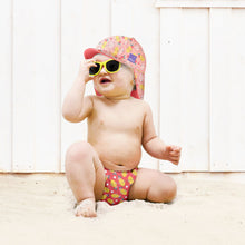 Load image into Gallery viewer, The Cloth Nappy Company Malta Bambino Mio Reversible Swim Hat Punch Lifestyle